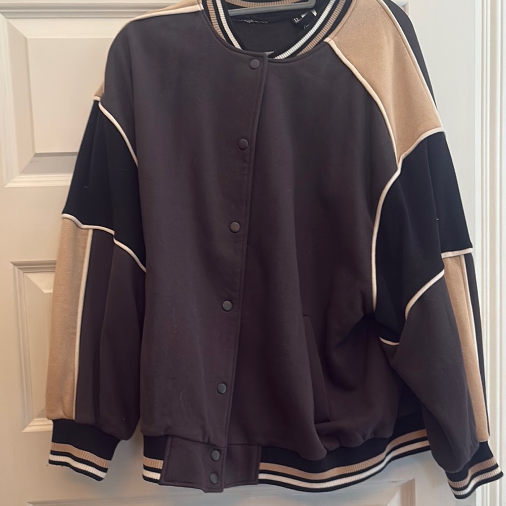 Divided Black Bomber Jacket with White Trim and Ribbed Details
